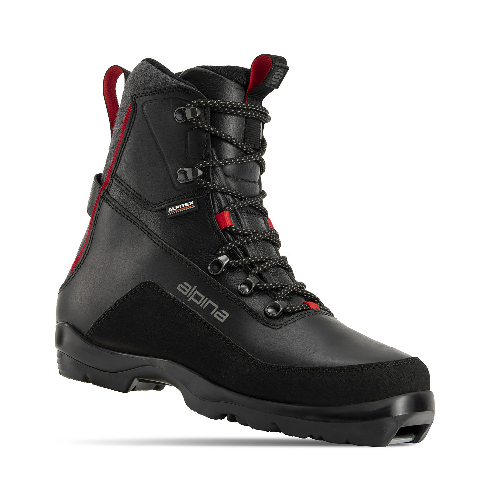 Alpina Discoverer Free backcountry ski boot, built for off-track touring in winter conditions. The black high-cut boot features a water-resistant ALPITEX membrane, padded ankle support, red highlights, and a grippy outsole. Designed for wamot movementon rugged terrain.