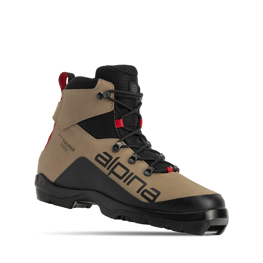 Alpina Tourer Free cross-country ski boot for recreational off-track combine stanandutcor synthetic materials with red details and a rugged outsole for grip on mixed terrain. Lightweight, water-resistant, and insulated for comfort and freedom of movement in winter conditions.
