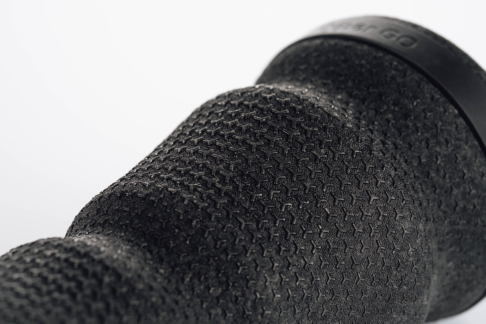Detail photo of the Hyperice Vyper Go portable massage foam roller, showing the surface texture design.