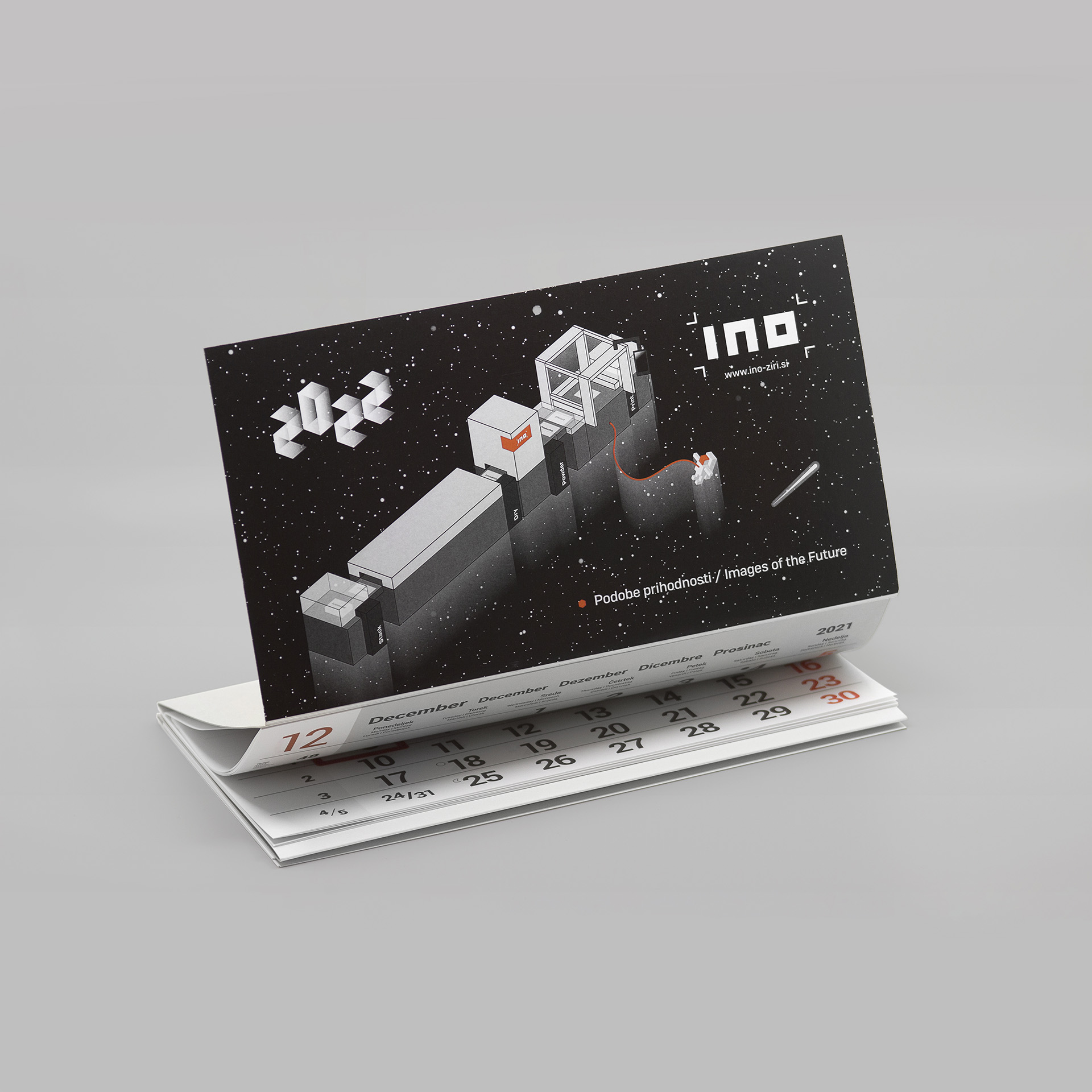 A photo of INO company’s business gift, calendar with custom illustrations in INO corporate identity.