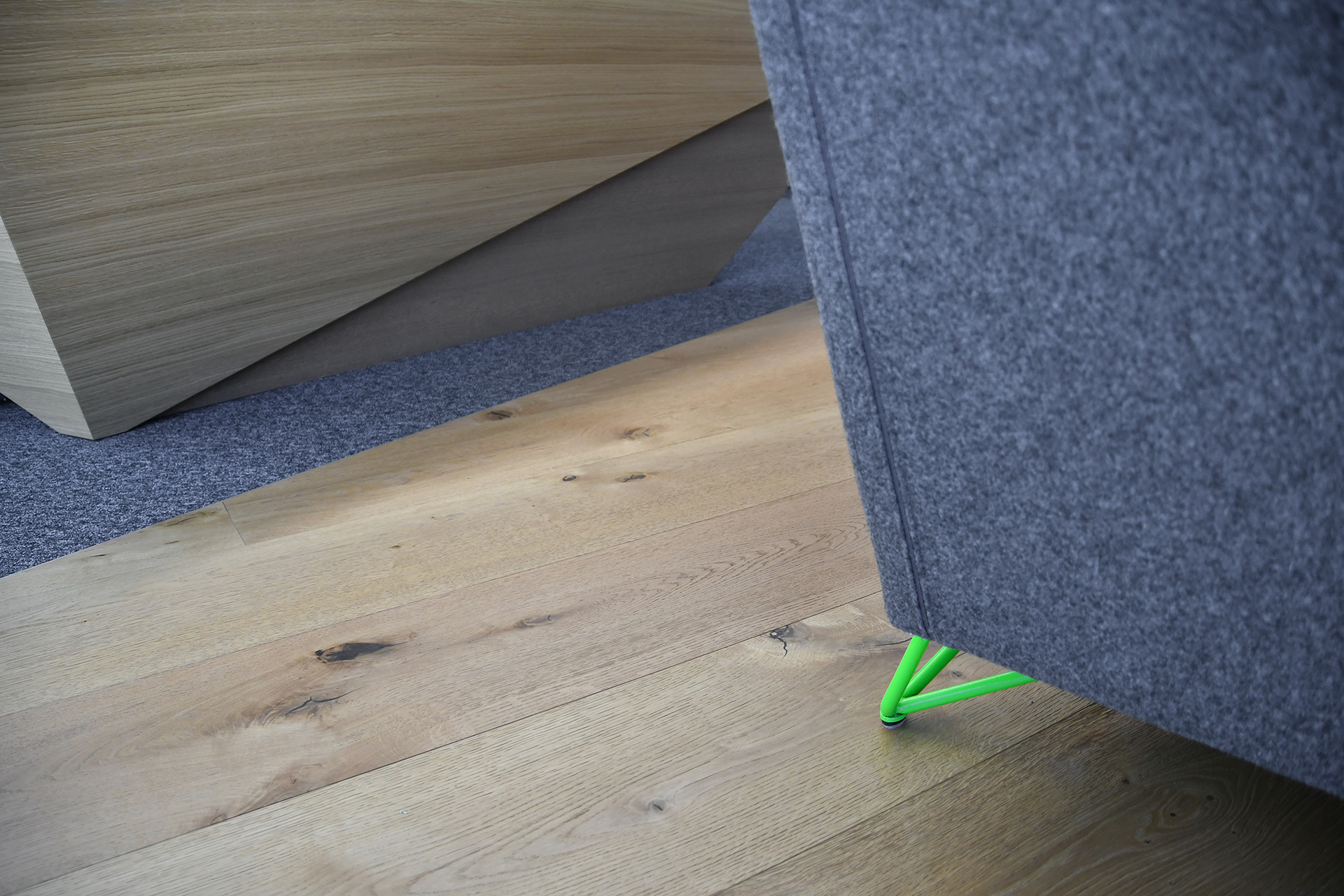 A photo of the Mebor company executive office space interior design, showing the furniture custom green details matching the corporate brand identity.