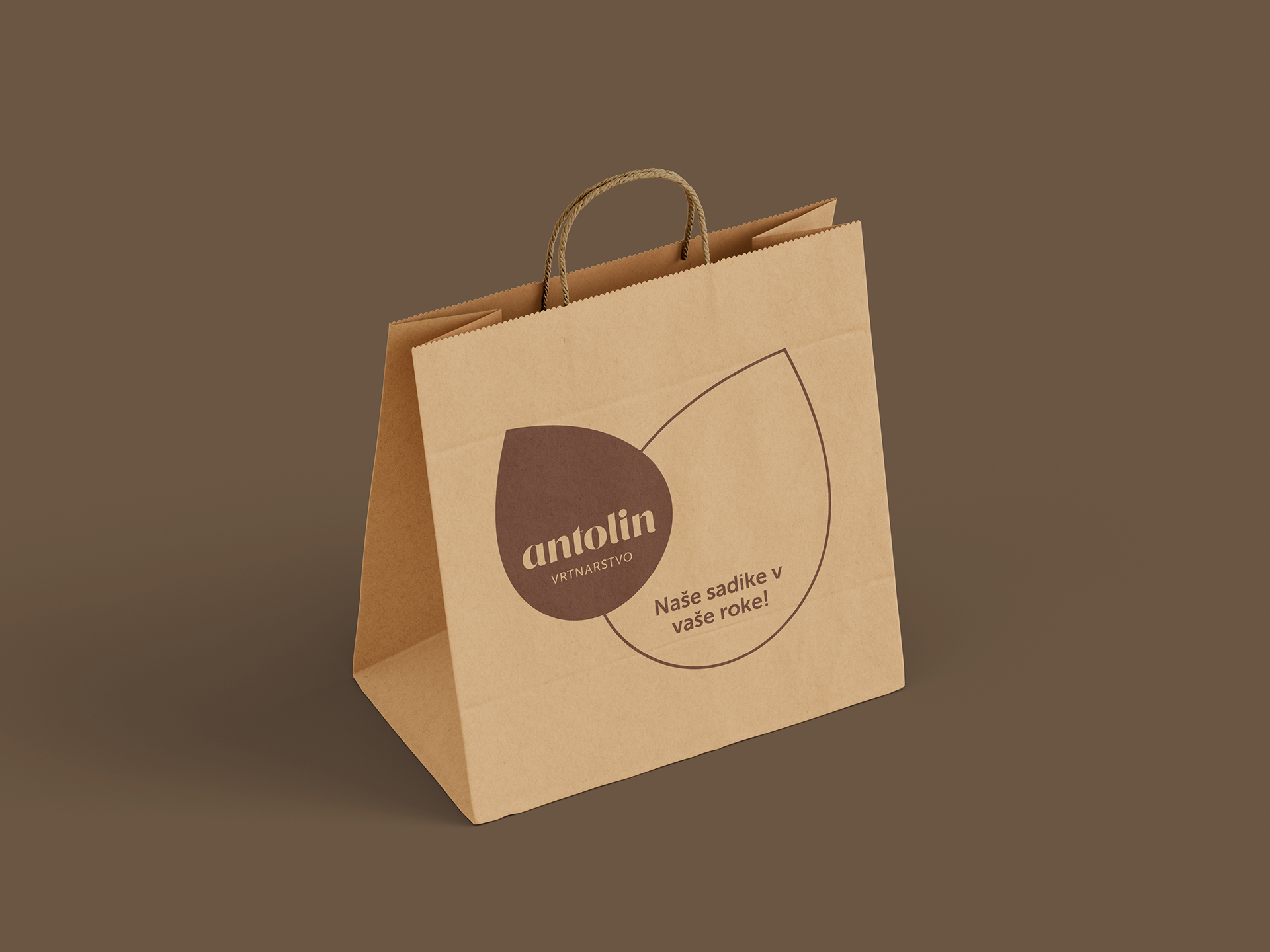 Visualisation of the Vrtnarstvo Antolin corporate brand identity design use case, showing a brown paper bag example with Antolin logo.