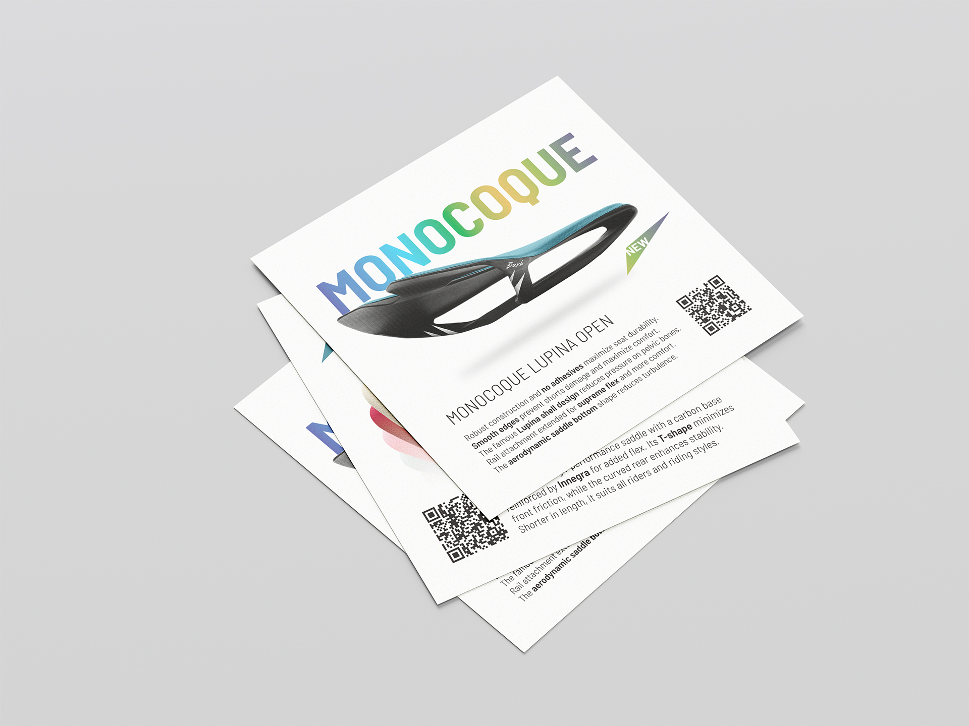 Promotional flyer for Berk Composites featuring a high-end carbon fibre bicycle saddle image and a bold, rainbow-colored “MONOCOQUE” title, highlighting the availability of the saddle in a variety of custom colours. The flyer also includes the updated Berk logo and a QR code for quick access to more information. The design reflects the brand’s emphasis on innovation, lightweight performance, and personalization.